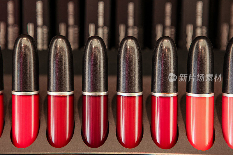 Various liquid lipsticks in red tone